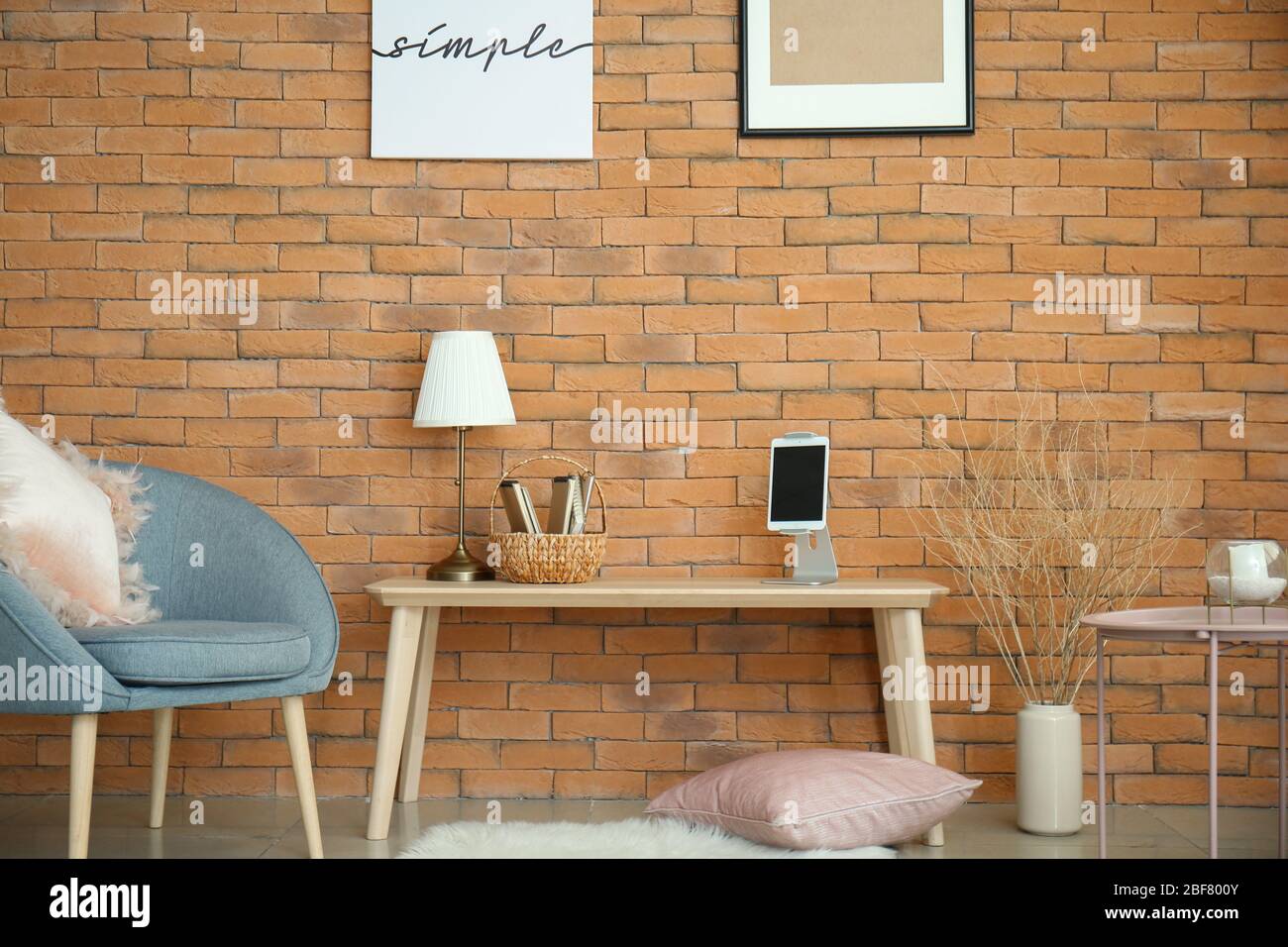 Interior of living room with brick wall Stock Photo - Alamy