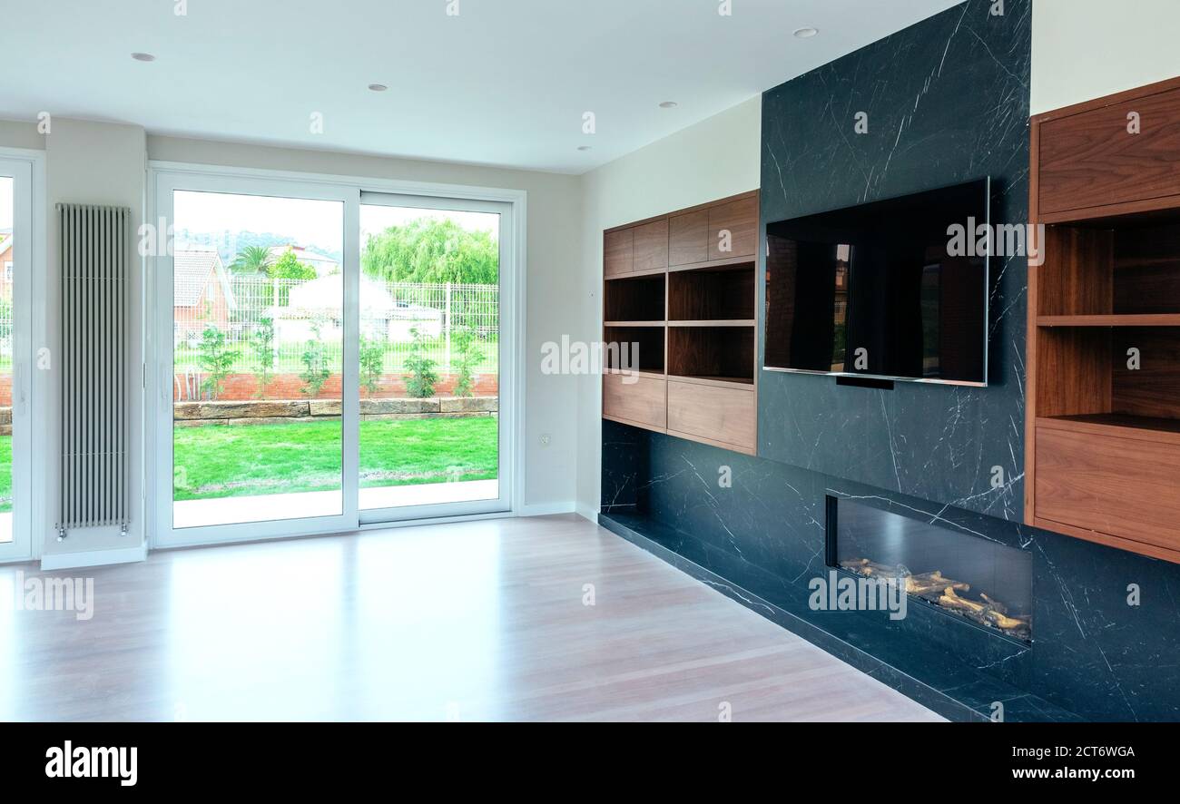 Living room with fireplace and TV Stock Photo - Alamy