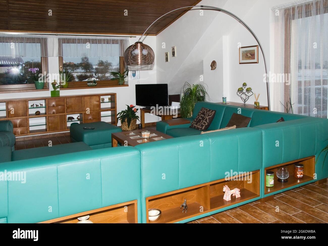 Modern living room in green Stock Photo - Alamy