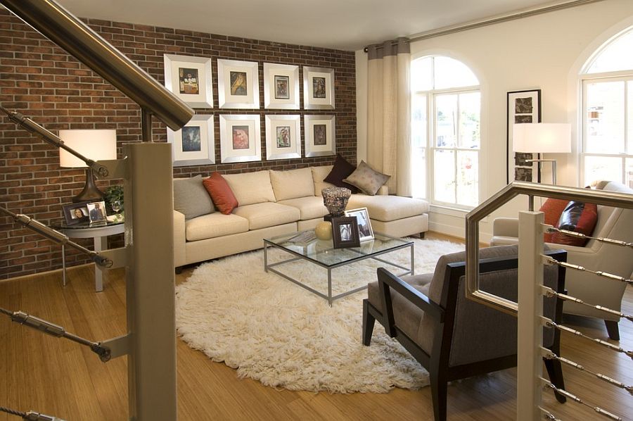 Gallery wall in the living room with exposed brick wall [Design: Carlyn ...