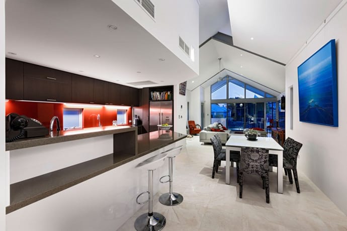 Chic Residence with Neutral Palette and Accents in a Vibrant Red