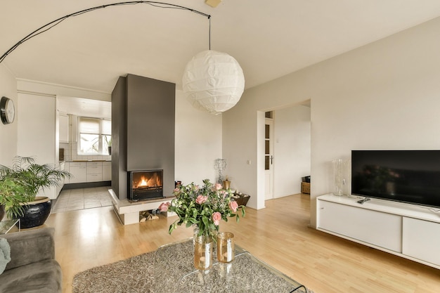 Premium Photo | A living room with a fireplace and a tv