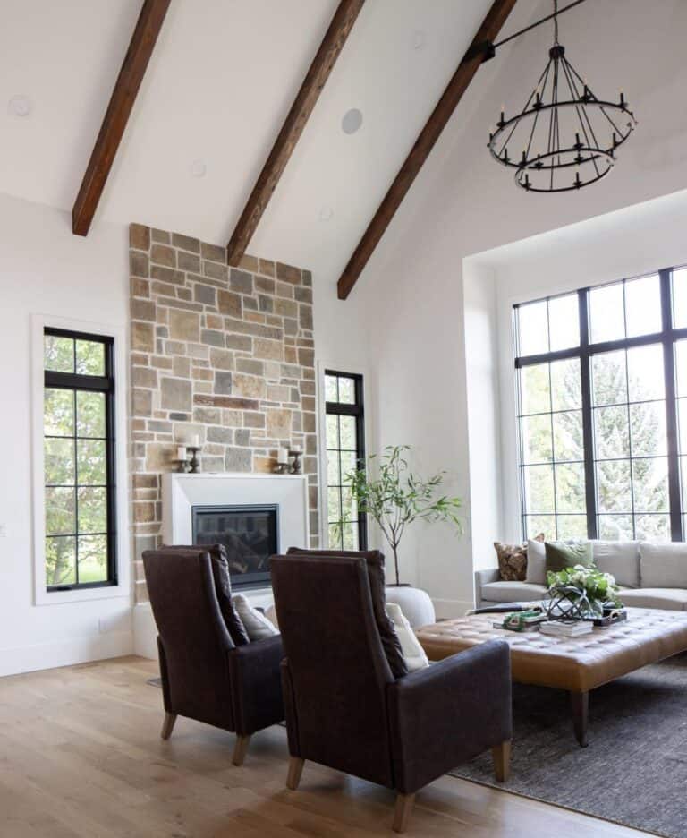 Living Room With Stone Fireplace and Vaulted Ceiling - Soul & Lane